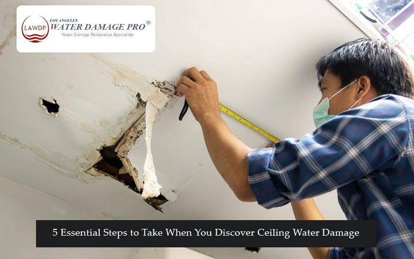 Ceiling with visible water damage and stains caused by a water leak.